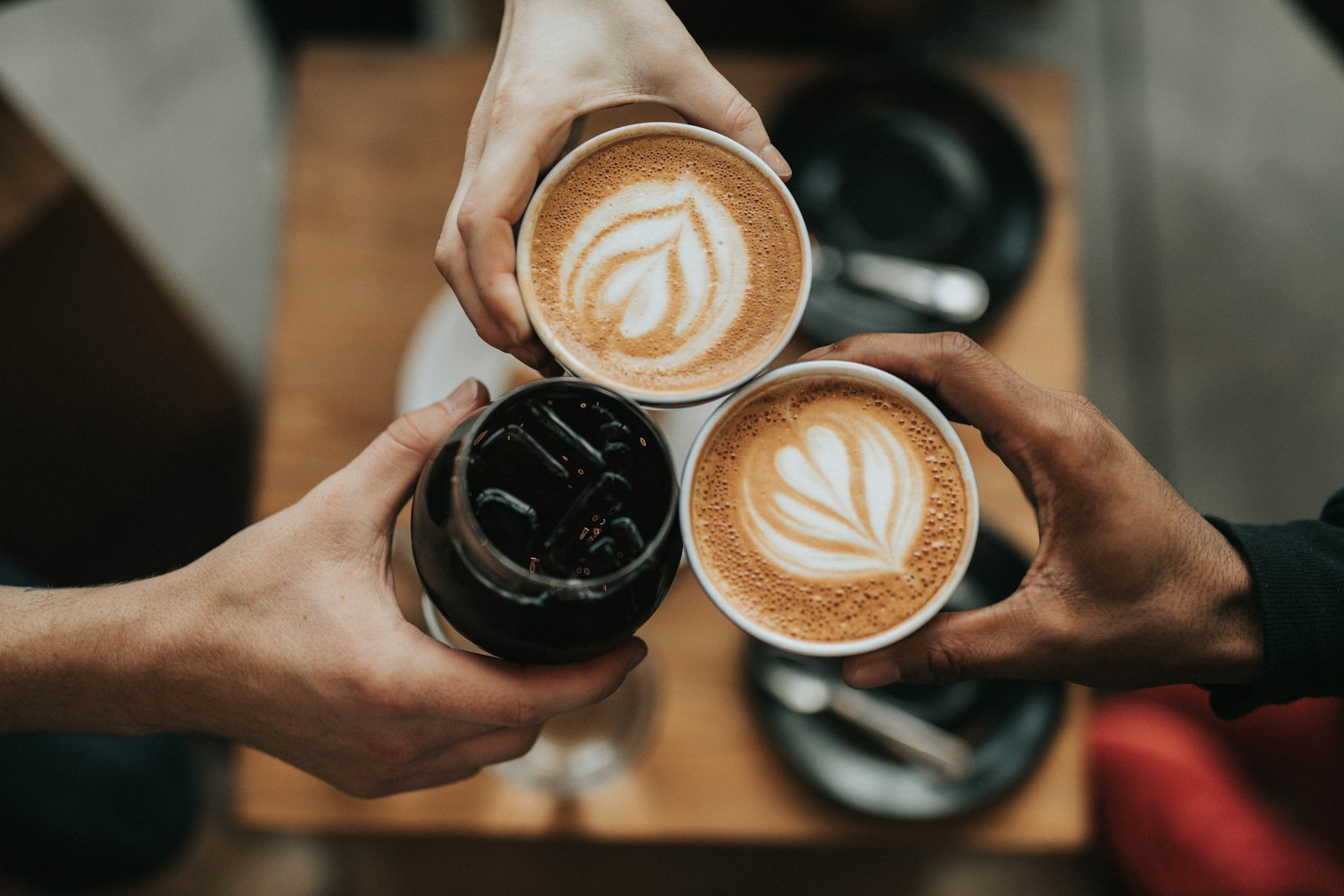 A warm cup of coffee on a table by a window (placeholder photo)